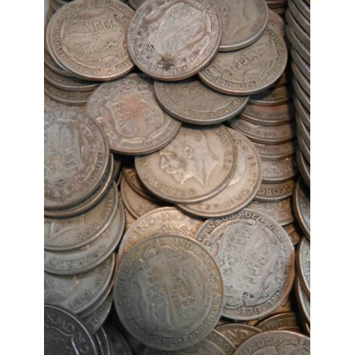 24 - Approximately 1500 grams of British pre 1947 silver half crowns.