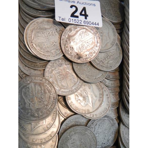 24 - Approximately 1500 grams of British pre 1947 silver half crowns.