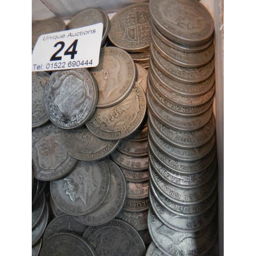 24 - Approximately 1500 grams of British pre 1947 silver half crowns.