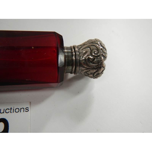 29 - A Victorian ruby glass double ended scent bottle, 5'' long, in good condition.