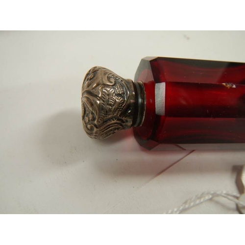 29 - A Victorian ruby glass double ended scent bottle, 5'' long, in good condition.