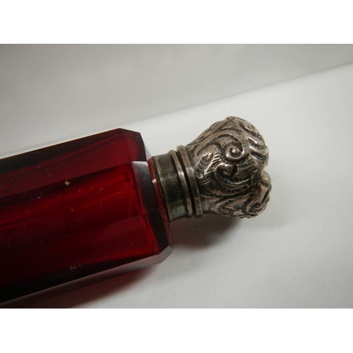 29 - A Victorian ruby glass double ended scent bottle, 5'' long, in good condition.