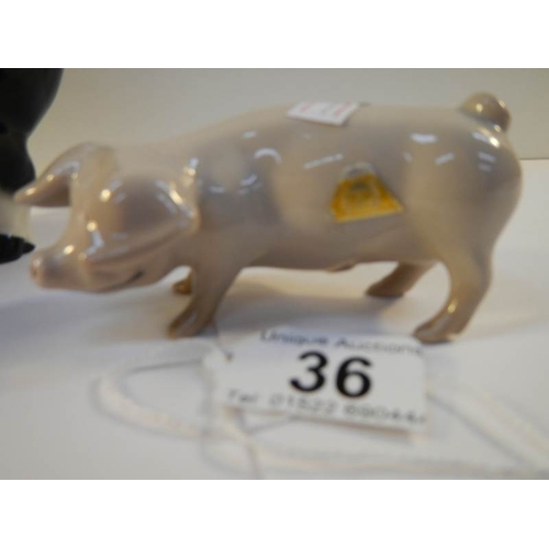 36 - A Royal Dux pig figure and another pig (possibly Beswick).