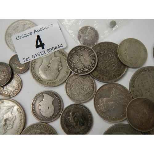 4 - A mixed lot of British pre 1947 silver coins, approximately 198 grams, 7 ounces