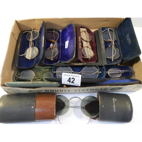 42 - 8 pairs of vintage spectacles in cases, possibly some gold but none marked.