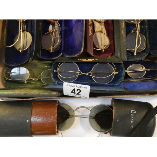 42 - 8 pairs of vintage spectacles in cases, possibly some gold but none marked.