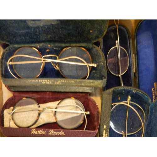 42 - 8 pairs of vintage spectacles in cases, possibly some gold but none marked.