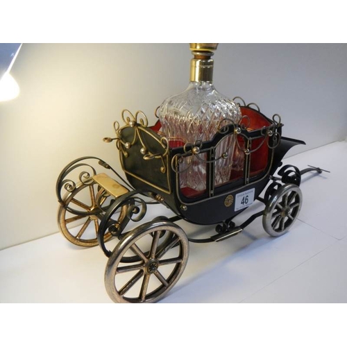 46 - A 1950's musical.decanter stand in the form of a carriage complete with decanter and 4 glasses.