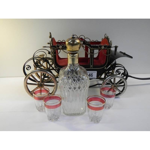 46 - A 1950's musical.decanter stand in the form of a carriage complete with decanter and 4 glasses.