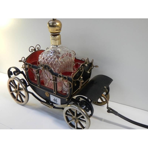 46 - A 1950's musical.decanter stand in the form of a carriage complete with decanter and 4 glasses.