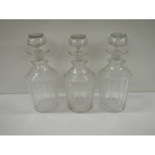 48 - A Victorian 3 bottle tantalus complete with decanters, in good condition.