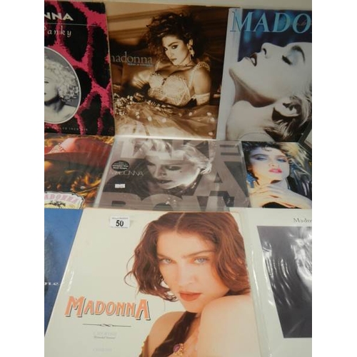 50 - 11 Madonna 12 inch records - 3 in near mint condition, 7 in good condition with a couple of minor sc... 