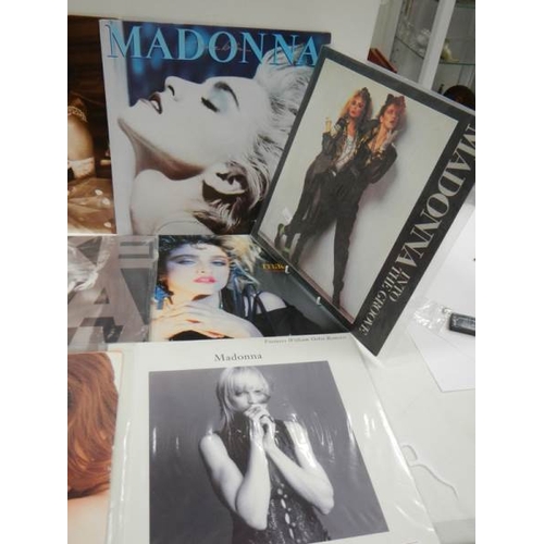 50 - 11 Madonna 12 inch records - 3 in near mint condition, 7 in good condition with a couple of minor sc... 