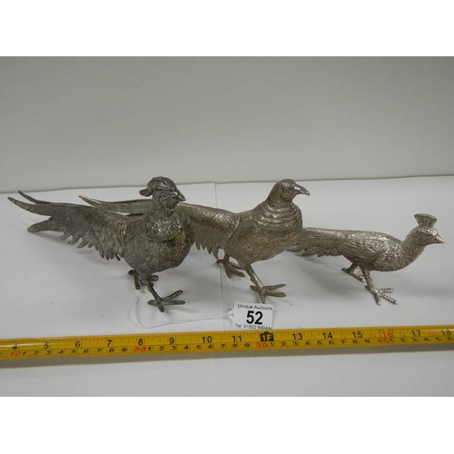 52 - A pair of silver plated pheasants and one other.