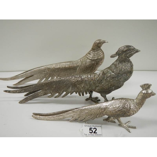 52 - A pair of silver plated pheasants and one other.