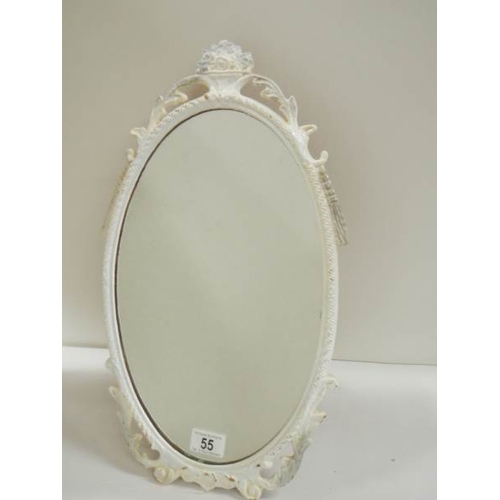 55 - A mid 20th century metal framed oval mirror, in good condition (19'' tall).