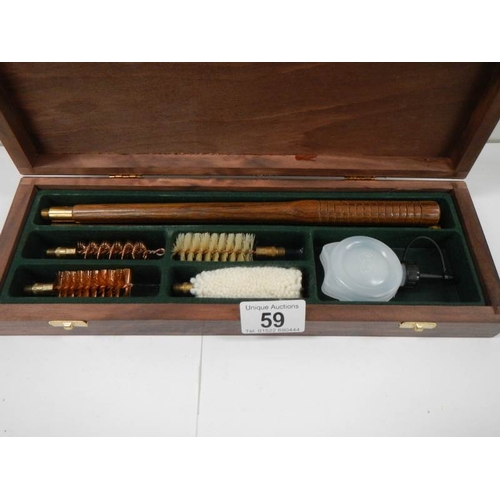 59 - A cased gun cleaning kit, complete.