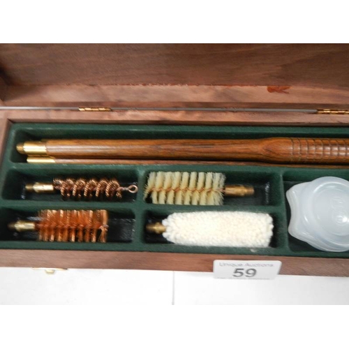 59 - A cased gun cleaning kit, complete.