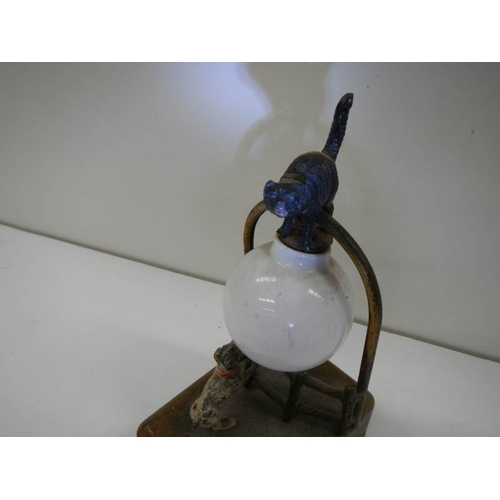 60 - A vintage bedtime light depicting a dog watching a cat that is balanced on the shade, (battery opera... 