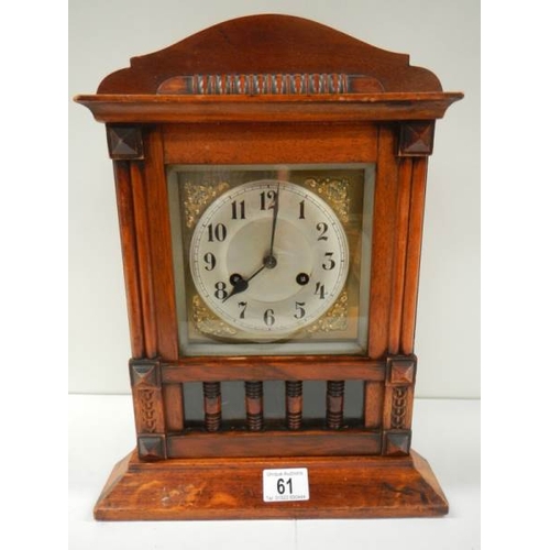 61 - An early 20th century mantel clock in working order (spring ok and complete).