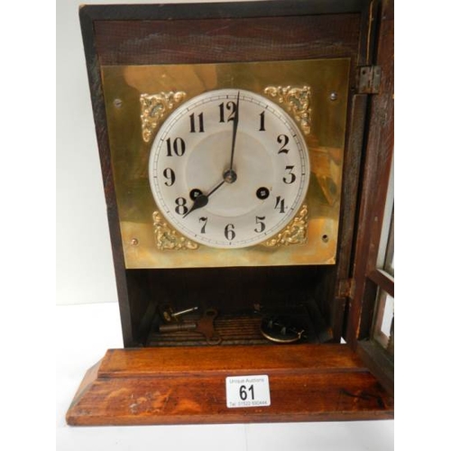 61 - An early 20th century mantel clock in working order (spring ok and complete).