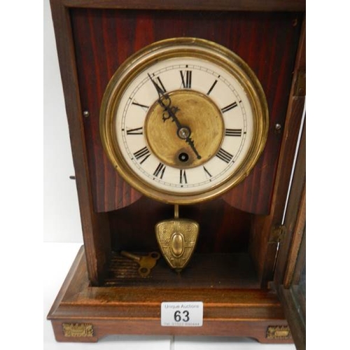 63 - A late Victorian mantel clock in working order.