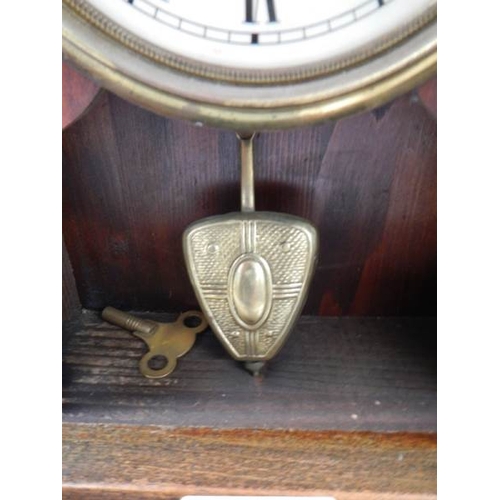 63 - A late Victorian mantel clock in working order.