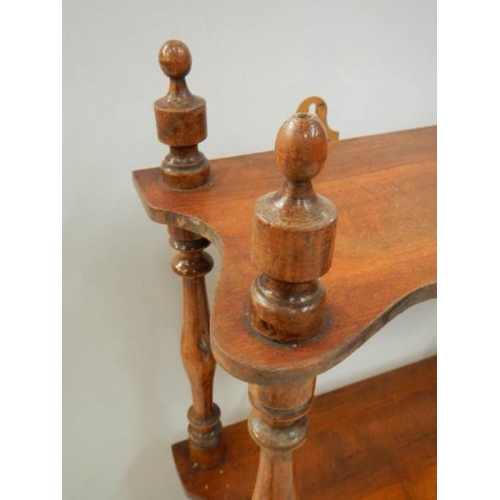 77 - A 3 shelf oak book rack with original turnings and finials, 29'' tall.