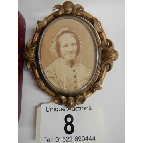 8 - A Victorian double sided mourning brooch with photo to one side and hair memorial set seed pearls to... 