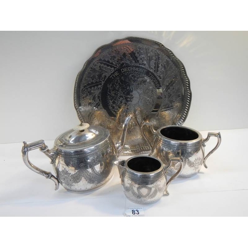 83 - A 4 piece silver plated tea set with pierced gallery tray on ball and claw feet.