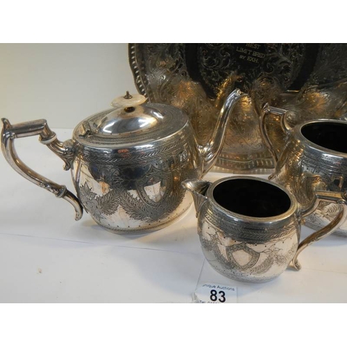 83 - A 4 piece silver plated tea set with pierced gallery tray on ball and claw feet.