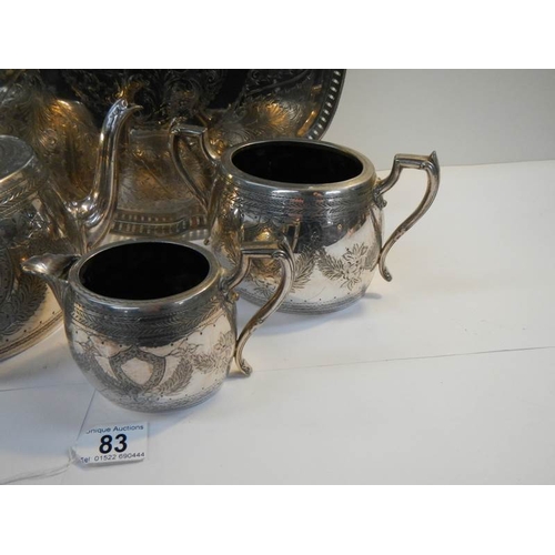 83 - A 4 piece silver plated tea set with pierced gallery tray on ball and claw feet.