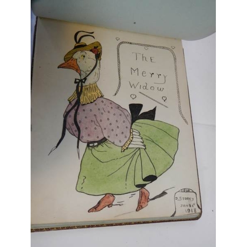 85 - An early 20th century autograph book with many drawings and watercolours.