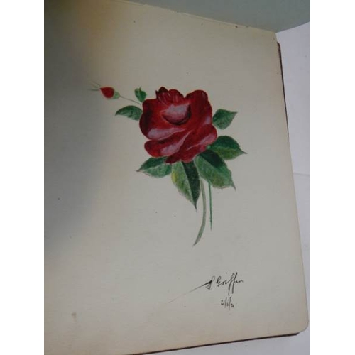 85 - An early 20th century autograph book with many drawings and watercolours.