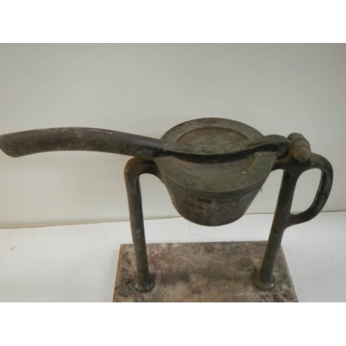 88 - An old citrus press in nickle on marble base (possilby French).