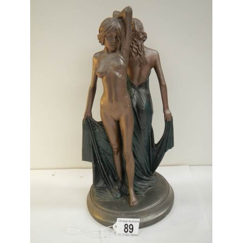 89 - An art deco style figure of a semi nude and a nude lady, 12.5'' tall.