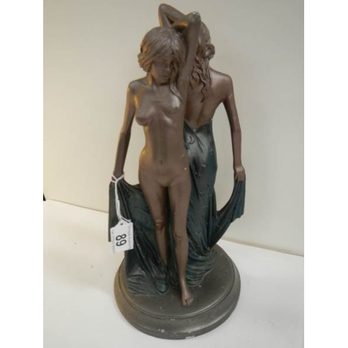 89 - An art deco style figure of a semi nude and a nude lady, 12.5'' tall.