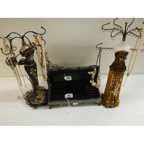 92 - 2 jewellery display figures and a jewellery box in the shape of a chaise longue.