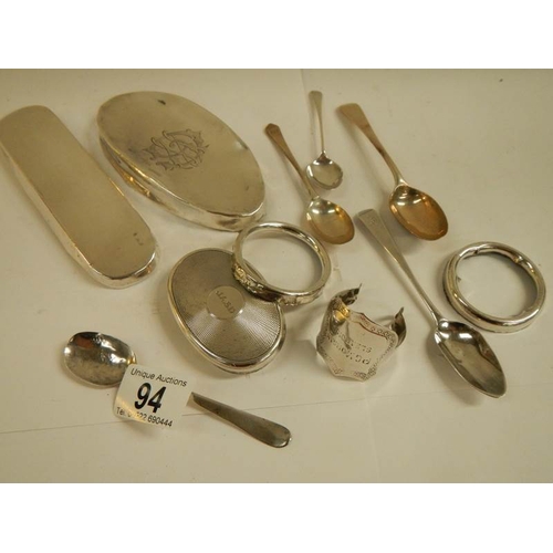 94 - A mixed lot of silver lids for glass bottles etc., silver spoons etc., 11 items in total weight 180g