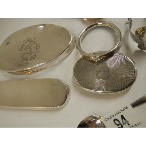 94 - A mixed lot of silver lids for glass bottles etc., silver spoons etc., 11 items in total weight 180g