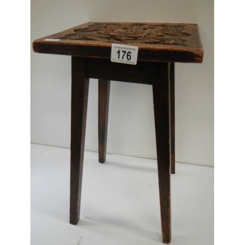 176 - A small side table with Tudor rose carved top, 16.5'' high x 10'' square.