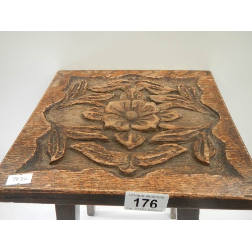 176 - A small side table with Tudor rose carved top, 16.5'' high x 10'' square.