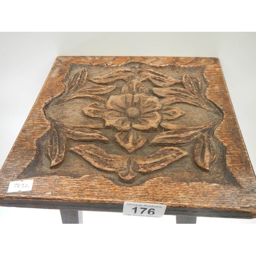 176 - A small side table with Tudor rose carved top, 16.5'' high x 10'' square.