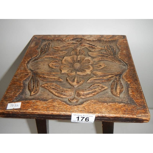 176 - A small side table with Tudor rose carved top, 16.5'' high x 10'' square.