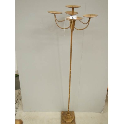 177 - A tall gilded candle holder with embellishments, 43'' tall.