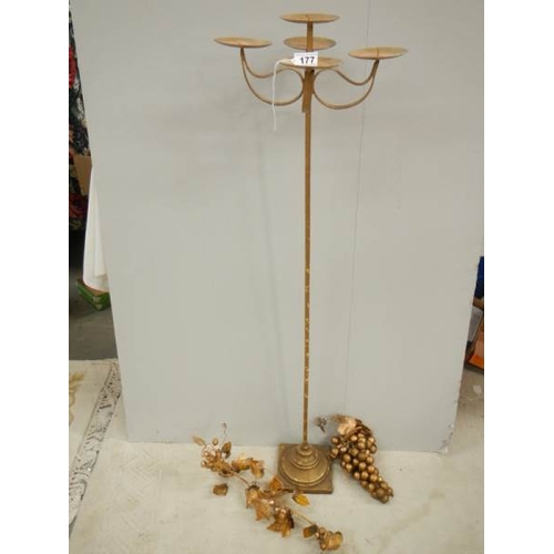 177 - A tall gilded candle holder with embellishments, 43'' tall.