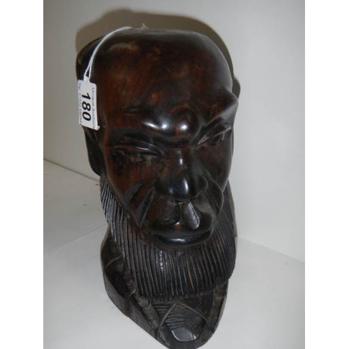 180 - A carved hardwood bust of a man in good condition, 10'' tall