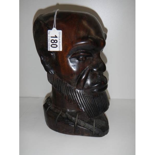 180 - A carved hardwood bust of a man in good condition, 10'' tall