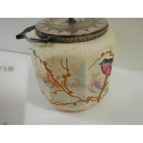 182 - A late Victorian biscuit barrel hand painted with birds and with plated lid and handle.