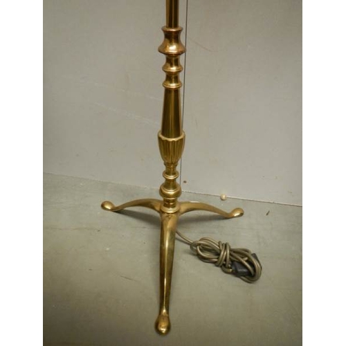 186 - A 20th century brass standing lamp in gilded rope design, 60'' tall and in good condition.